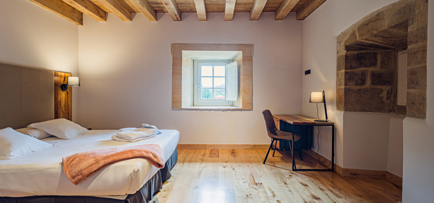 View from the bed and bathroom of one of the double rooms.