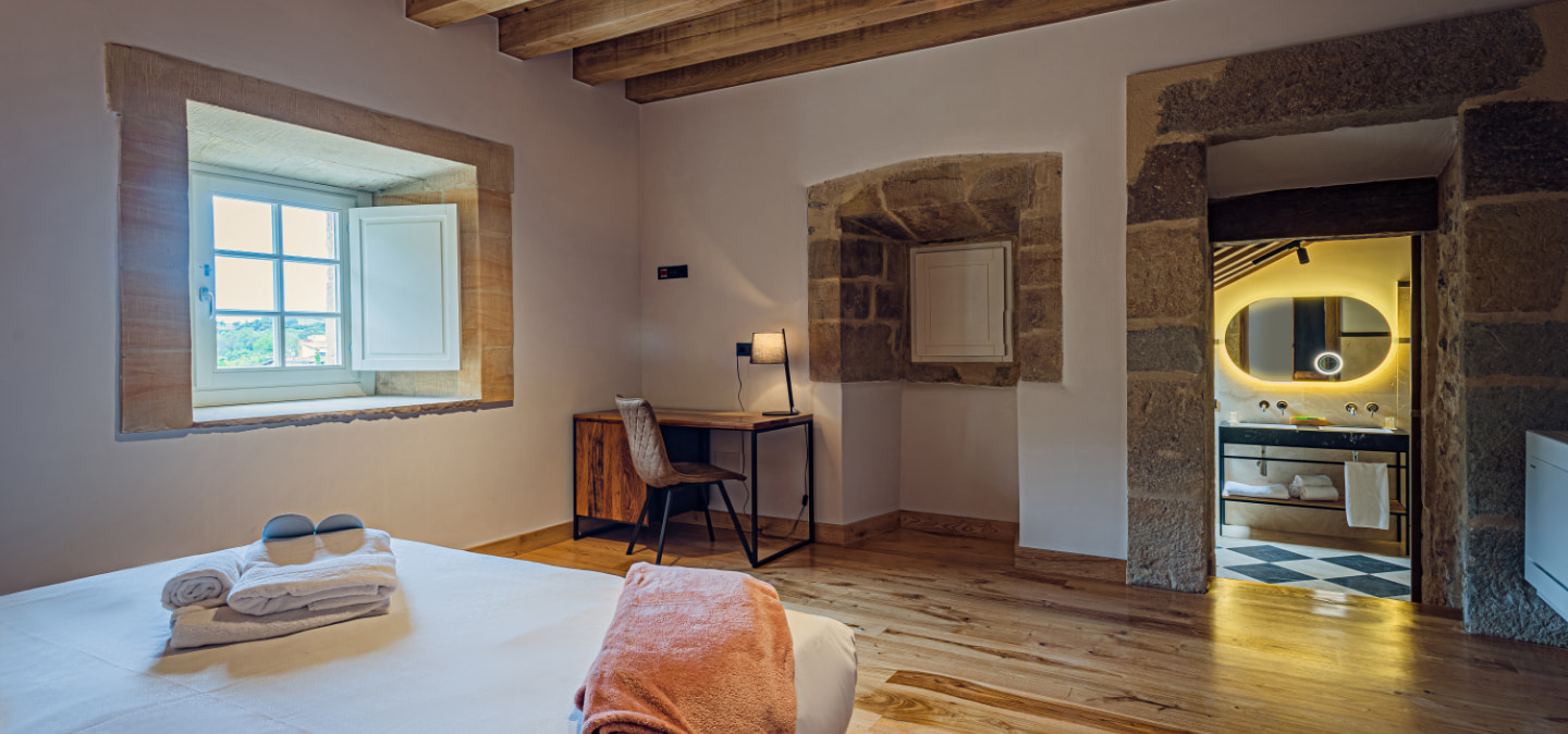 View from the bed and bathroom of one of the double rooms.